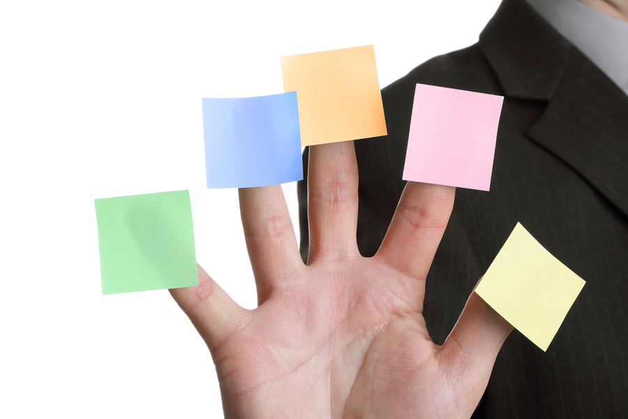 bigstock-Businessman-holds-up-five-blan-16554350