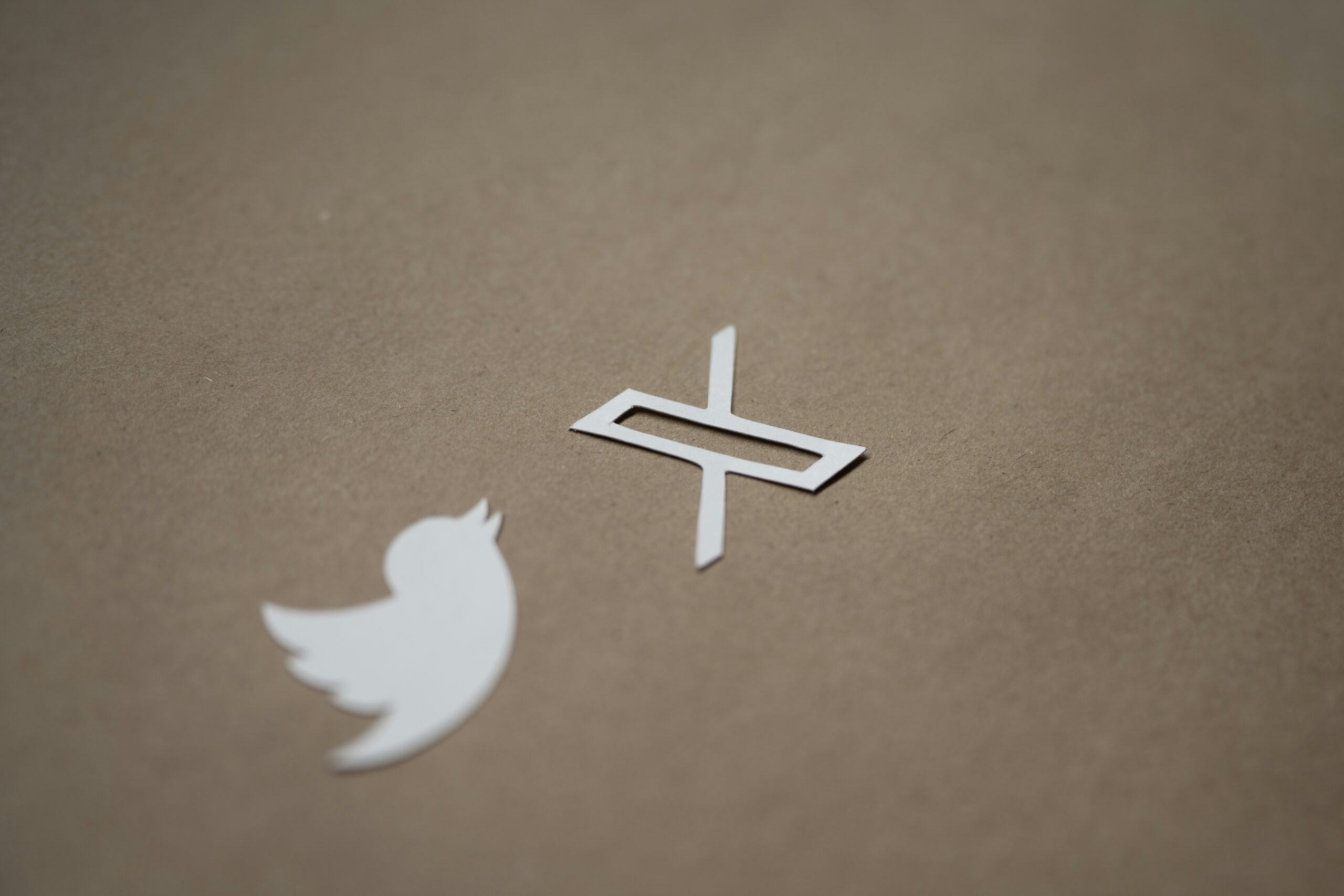 Twitter and X symbols on a background